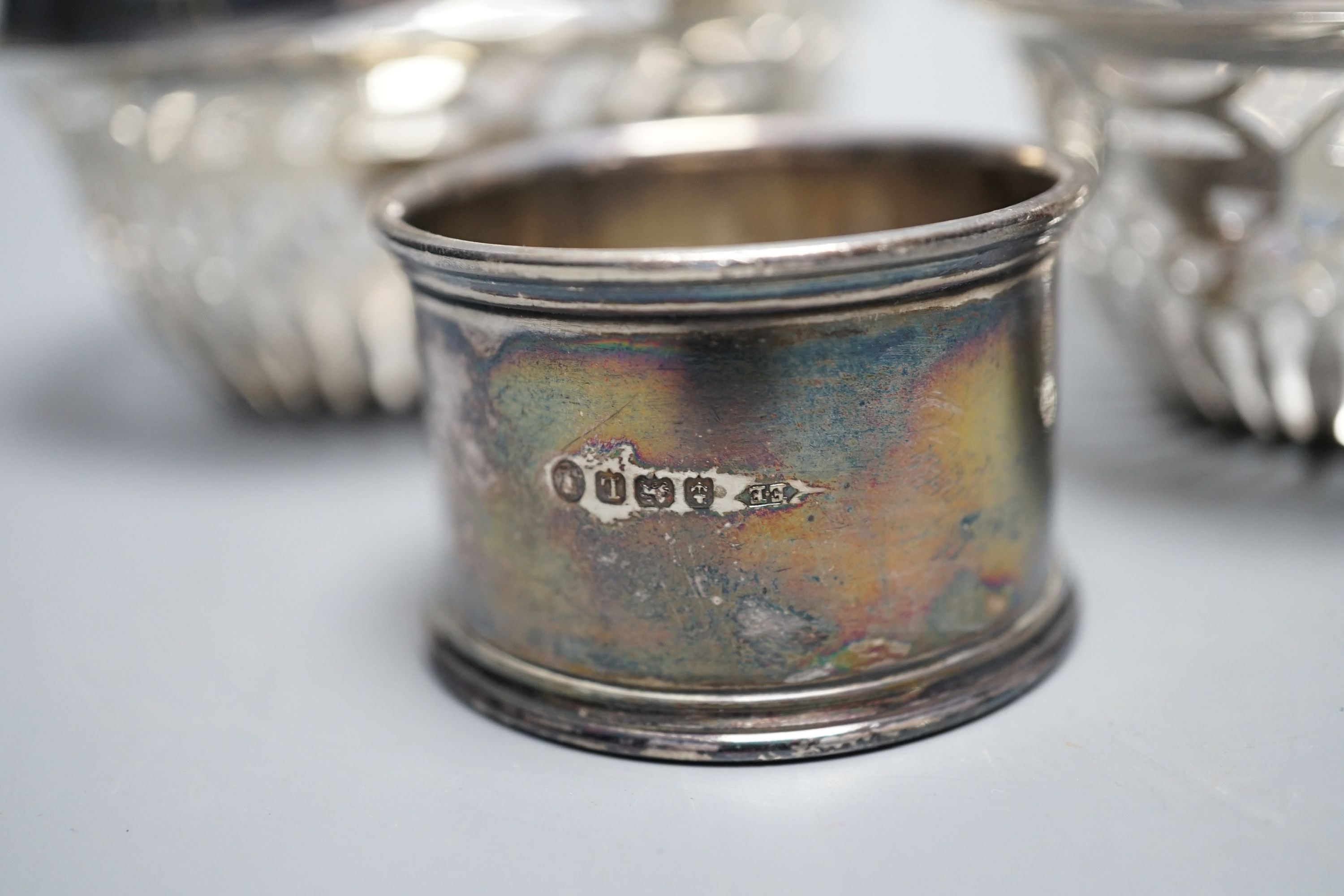 A pair of George V pierced silver bonbon baskets, a small pedestal bowl and napkin ring and two small Danish enamelled bowls.